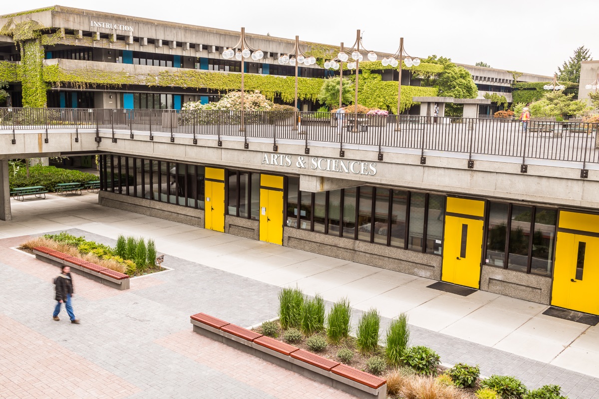 North Seattle College Arts & Sciences building with yellow doors and and Instruction Building in background.