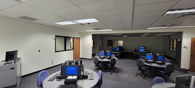 classroom with desks and computers