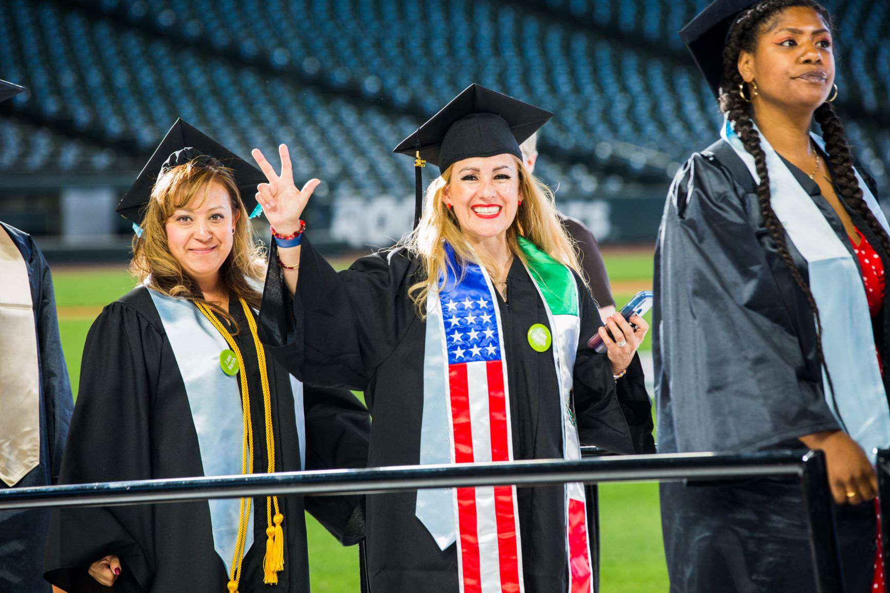 female graduates in black caps and gowns