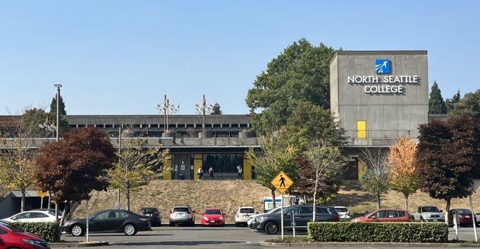 parking lot with cars and north seattle college building