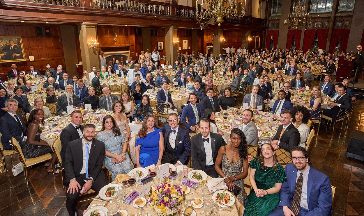 People dressed up sitting at tables