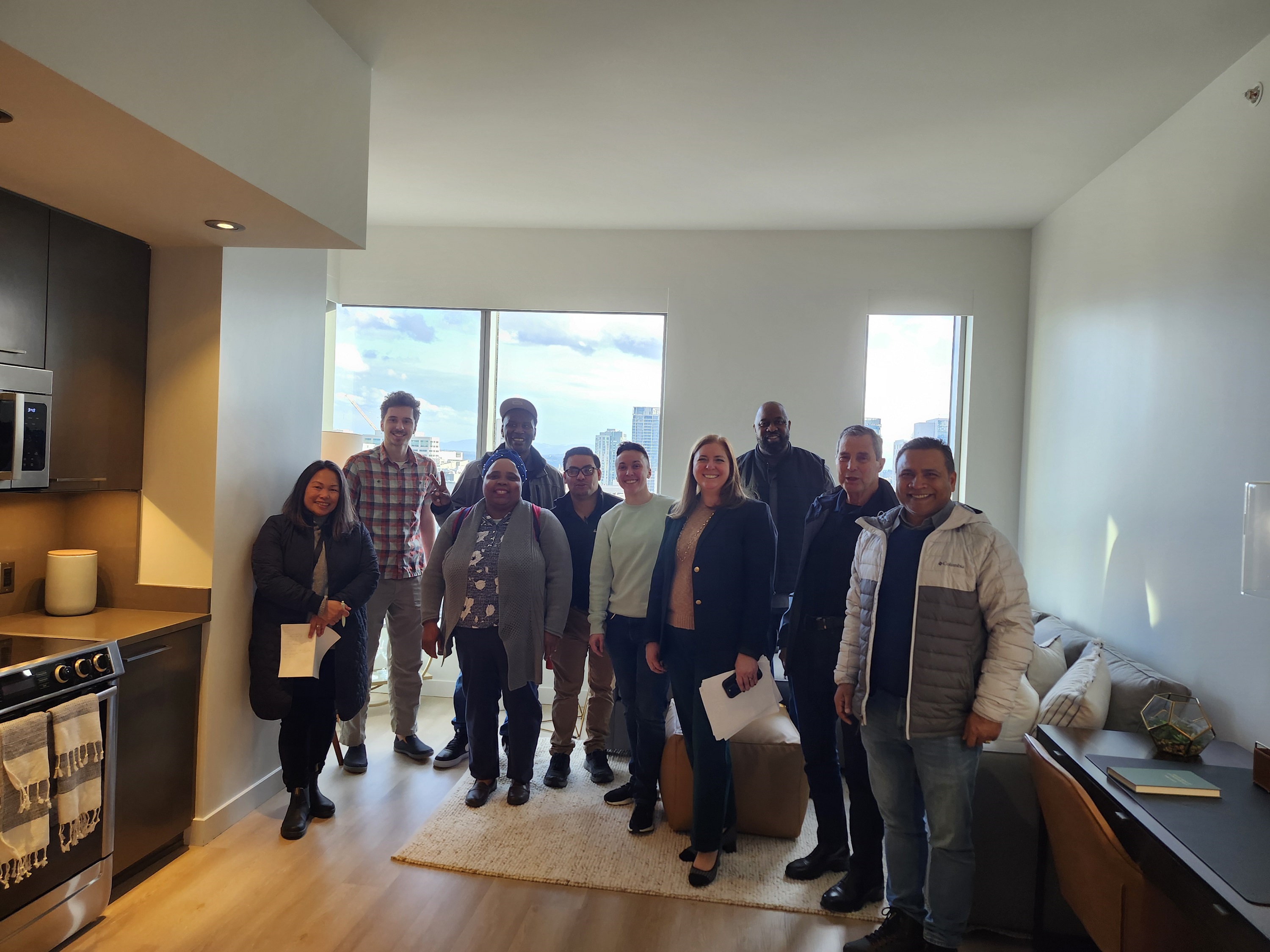 NSC Real Estate Club students standing in a high rise apartment