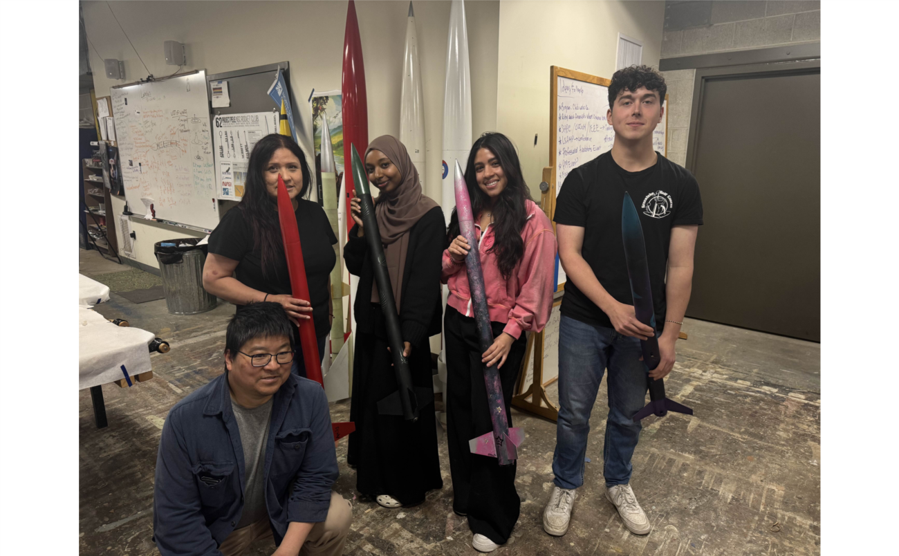 NSC students holding a rocket 