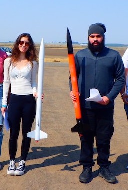Rocketry Club members holding rockets