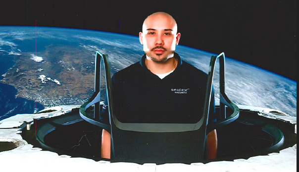 photo of man wearing a black shirt with space x logo on it peering out of a spacecraft in space with earth in background